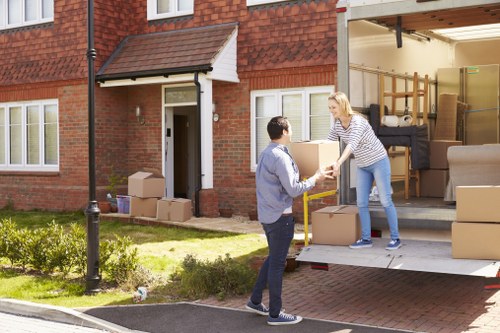 Team securing boxes and furniture inside a moving van