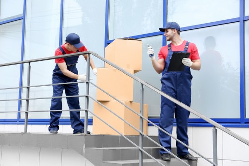 Mover checking safety around a loaded van before a relocation job