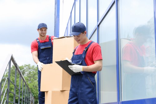 Professional removals team loading a van in Catford