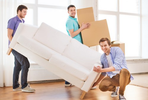 Man with a van loading furniture for a Catford move