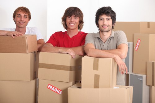 Loading furniture into a removals van in Catford