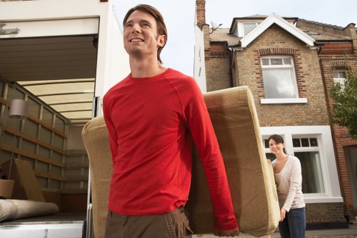 Catford man and van removal team unloading items at a property