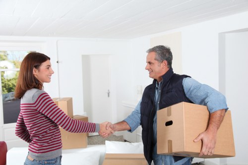 Professional movers handling furniture in Catford