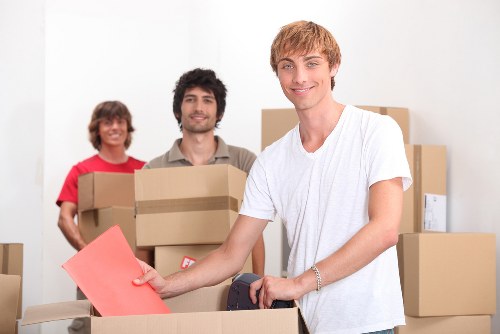 Packed moving boxes prepared for urgent Catford relocation